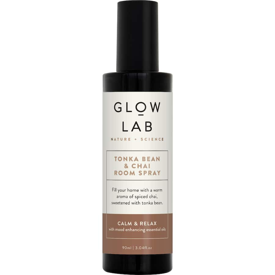 Elegant glass bottle of Glow Lab Air Freshener Room Spray, blending Tonka Bean and Chai for a calm, inviting atmosphere.