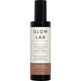 Elegant glass bottle of Glow Lab Air Freshener Room Spray, blending Tonka Bean and Chai for a calm, inviting atmosphere.