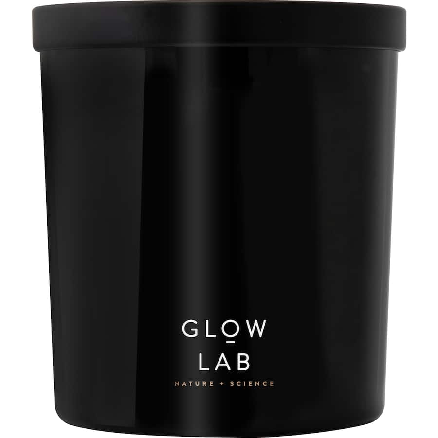 Glow Lab Coconut & Sandalwood Candle in dark glass, features tropical scents, burns 40-60 hours, perfect for relaxation.