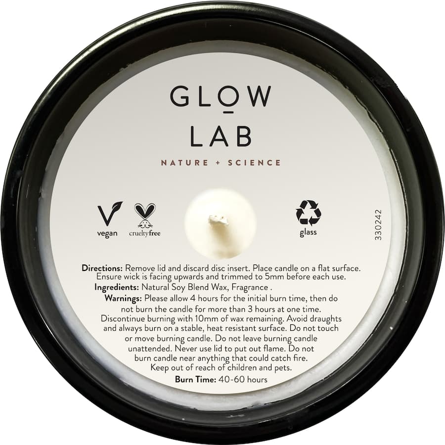 Glow Lab Coconut & Sandalwood candle in dark glass, natural soy wax, rich tropical aroma, burns 40-60 hours for relaxation.