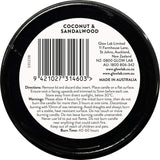 Glow Lab Coconut & Sandalwood candle in a dark glass vessel, featuring tropical scents and 40-60 hours burn time for relaxation.