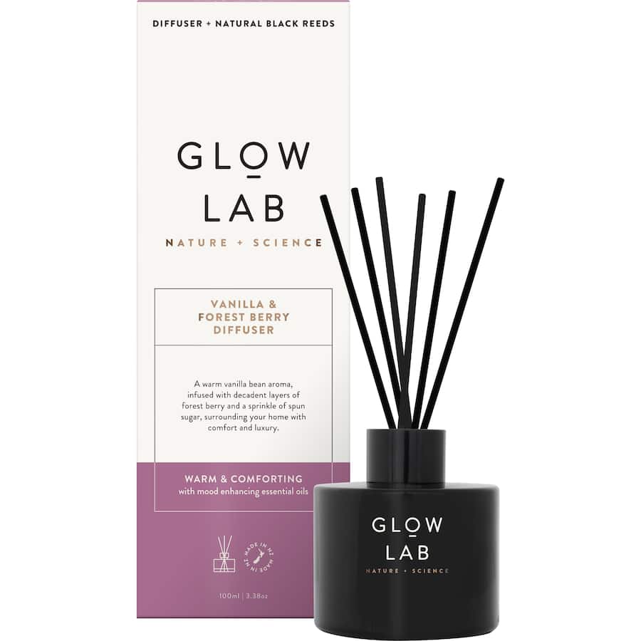 Glow Lab Reed Diffuser in dark glass, featuring warm Vanilla & Forest Berry scents for cozy home ambiance.