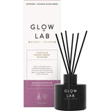 Glow Lab Reed Diffuser in dark glass, featuring warm Vanilla & Forest Berry scents for cozy home ambiance.