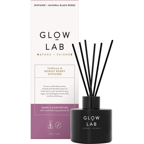 Glow Lab Reed Diffuser in dark glass, featuring warm Vanilla & Forest Berry scents for cozy home ambiance.