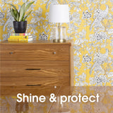 Pledge Furniture Polish Lemon bottle, designed to clean and shine wood and laminate surfaces with a fresh lemon scent.