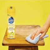 Pledge Furniture Polish Lemon bottle showcasing cleaning agents for wood and laminate surfaces, effortlessly removing marks and enhancing shine.