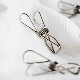 Durable Seymours stainless steel clothes pegs with a strong grip, rust-resistant and eco-friendly for reliable laundry drying.