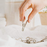 Durable Seymours stainless steel clothes pegs, rust-resistant and eco-friendly, perfect for secure indoor and outdoor laundry drying.