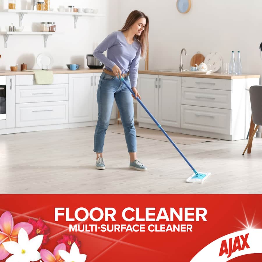 Ajax Floor Cleaner Divine Blends bottle, designed for all floor surfaces, featuring a refreshing tropical breeze scent.