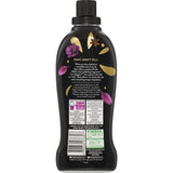 Fluffy Concentrate Fabric Softener with Spice Allure scent, softens fabrics, reduces wrinkles, and is eco-friendly in a recyclable bottle.