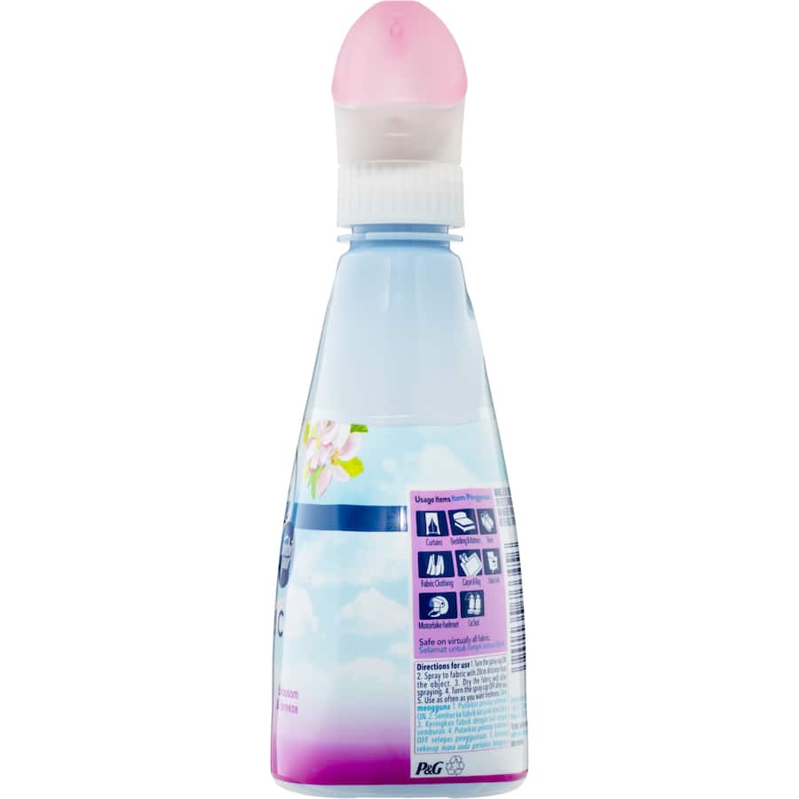 Febreze Fabric Freshener in Blossom & Breeze scent, effectively eliminates odors and 99.9% of bacteria for fresh-smelling fabrics.
