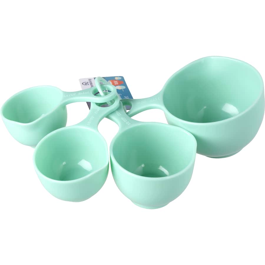 Set of four durable measuring cups with clear ml markings and side pourer for precise cooking and baking.