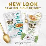 Fancy Feast Broths featuring tender chicken and vegetables in a silky, flavorful broth for a gourmet cat dining experience.