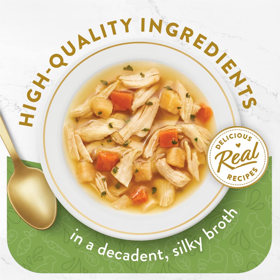 Gourmet cat food featuring tender chicken and vegetables in a rich broth, free from artificial ingredients and fillers.