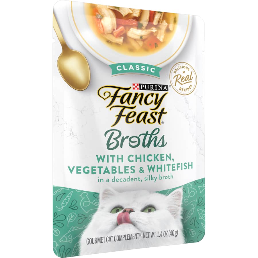 Gourmet cat food featuring chicken, whitefish, and vegetables in a flavorful broth, perfect for picky eaters.