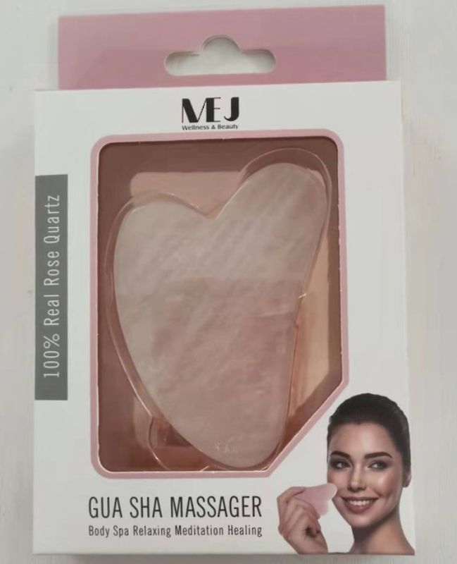 Rose Quartz Gua Sha massager for improved circulation, skin glow, and puffiness reduction; suitable for all skin types.