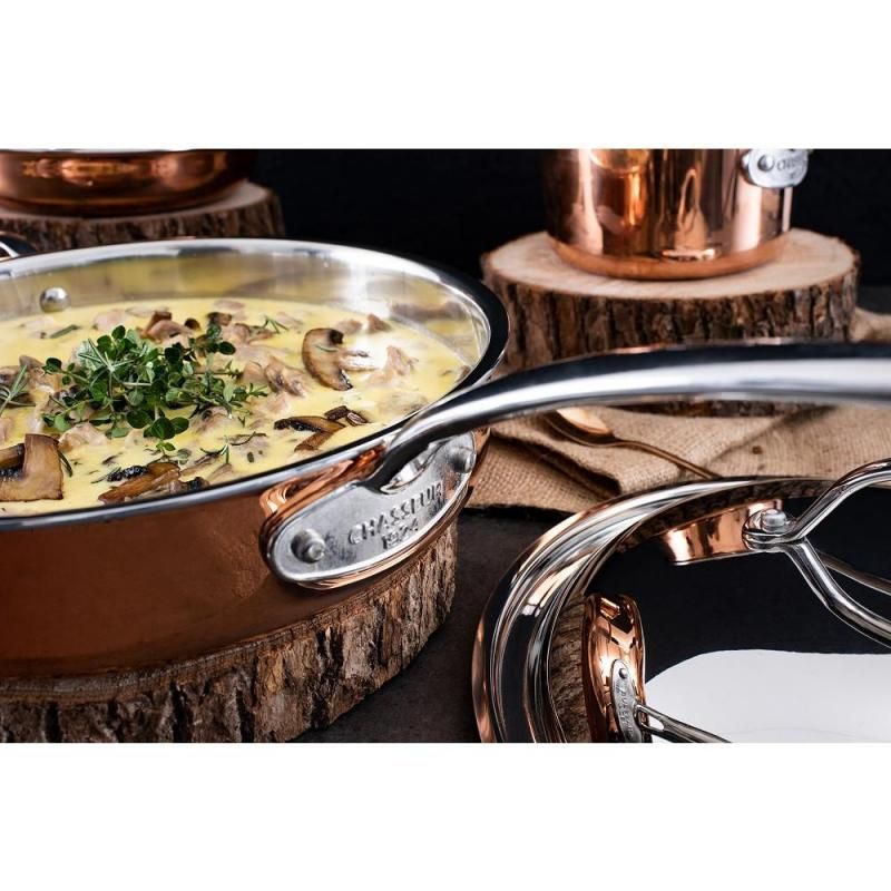 Chasseur Escoffier 28cm induction fry pan with elegant copper exterior, 4-layer design, and ergonomic handle for versatile cooking.