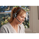 Jabra Evolve 65 headset, wireless with 30m range, 12-hour battery, passive noise cancellation, and Bluetooth dual connectivity.