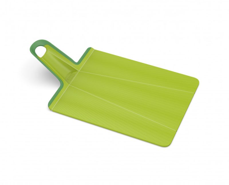 Green Joseph Joseph Chop2Pot Plus chopping board with folding sides for easy ingredient transfer and textured cutting surface.