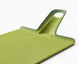 Green folding chopping board with textured surface, soft-grip handle, and non-slip feet for easy food prep and transfer.