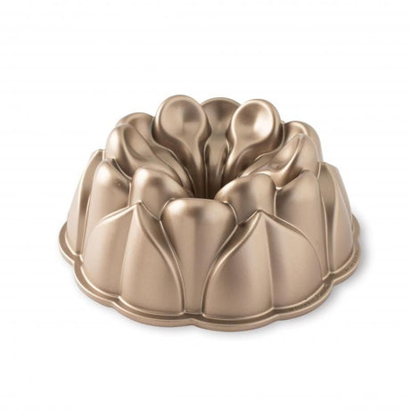 Nordic Ware Magnolia Bundt® Pan in toffee, featuring leaf designs and a blossom shape, perfect for elegant cake presentations.