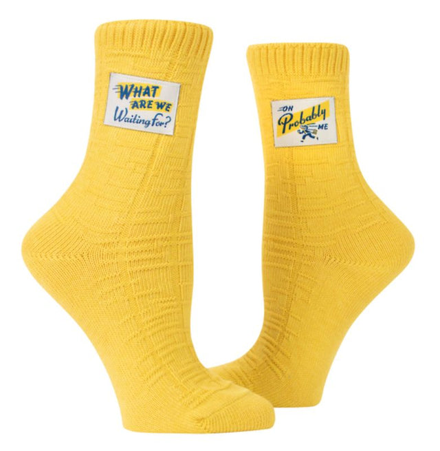 Blue Q Tag Socks in Large/Extra-Large feature witty designs, cushioned comfort, and organic cotton for a stylish and fun look.