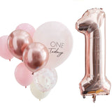 Pink and rose gold balloons set for 1st birthday, featuring a large "1" foil balloon and assorted sizes for a festive display.