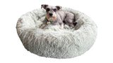 Soft seafoam doughnut pet bed with removable cover, non-slip base, and supportive raised rim for calming comfort.