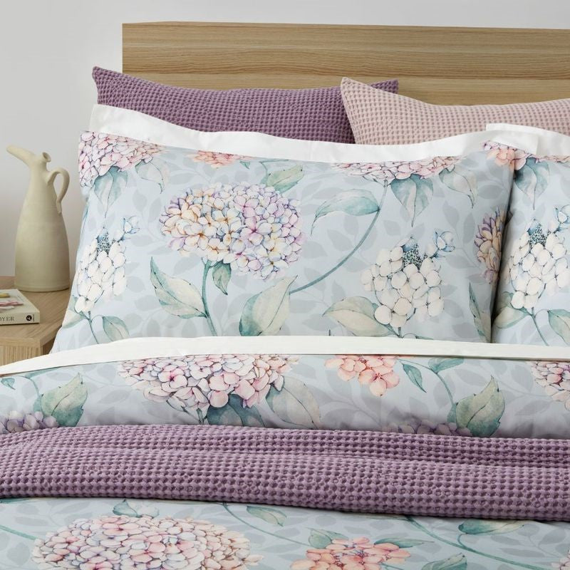 Floral hydrangea duvet cover set in pink and purple on green, made from 100% OEKO-TEX® cotton, ethically made in Turkey.