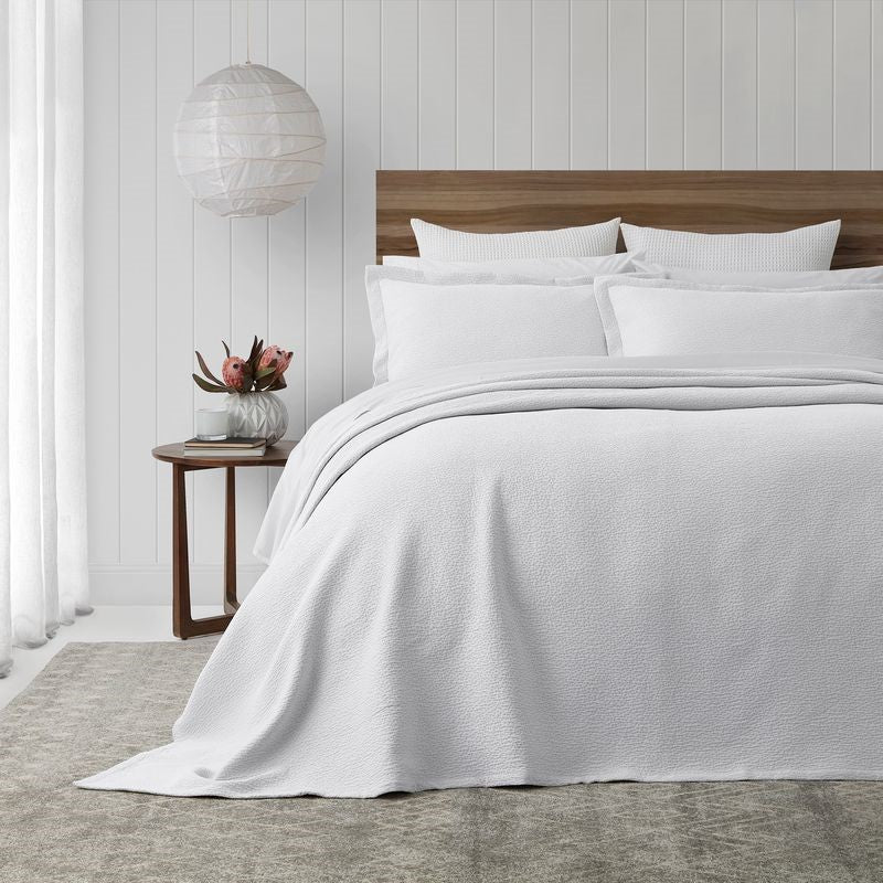 White super king bedspread set with textured design, mitred corners, and includes two Oxford pillowcases.