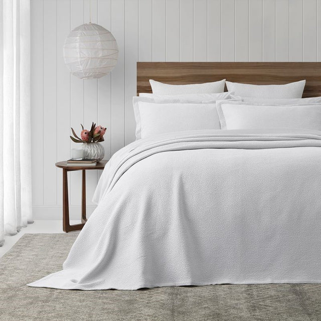 Elegant white PORTO bedspread set, featuring stonewashed cotton with subtle texture and mitred corners, made in Portugal.