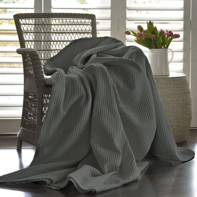 Charcoal waffle blanket by Baksana, 240 x 260 cm, made from 100% cotton for stylish texture and warmth in any space.