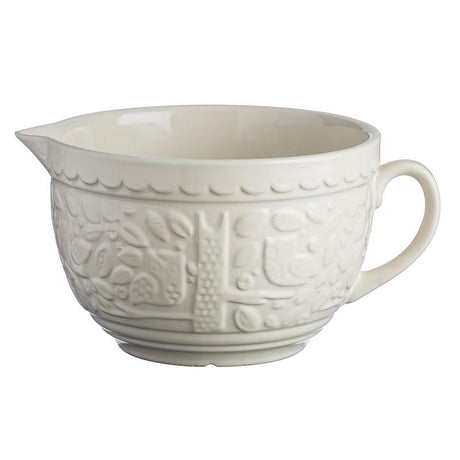 Mason Cash 1L Measuring Jug in ivory stoneware, featuring embossed forest scenes, perfect for baking and kitchen display.