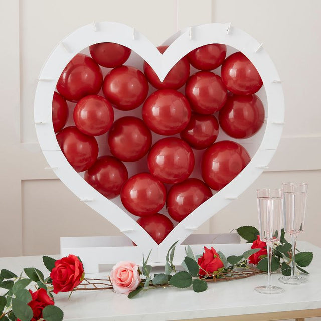 Heart-shaped balloon mosaic stand for romantic occasions, eco-friendly design, easy to assemble, perfect centerpiece for celebrations.