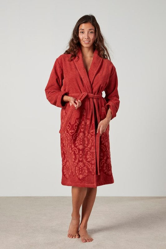 Clay-colored jacquard floral bathrobe with shawl collar, pockets, and waist tie, made from OEKO-TEX® certified cotton.