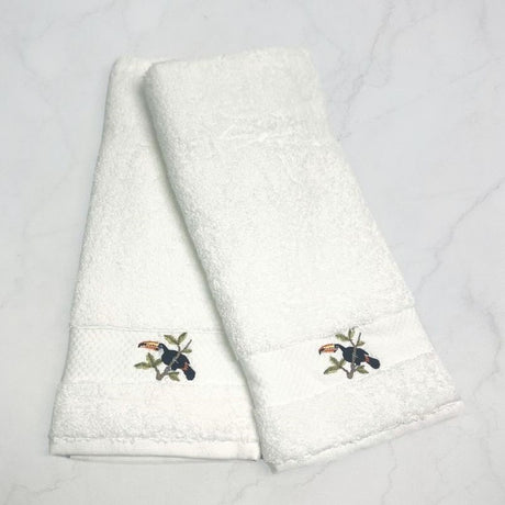 Set of 2 embroidered Turkish cotton towels featuring a vibrant toucan design, perfect for gifting or personal use.