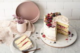 Rose gold 20cm round cake pan with non-stick surface, perfect for even baking and easy release of desserts.