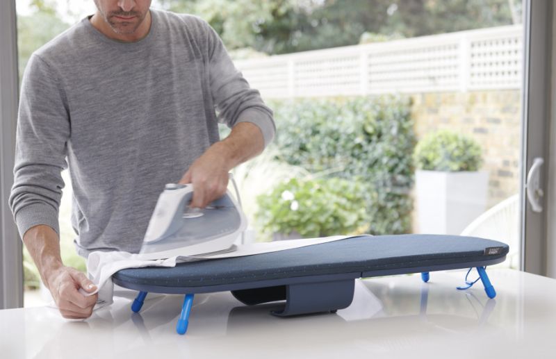 Compact Joseph Joseph Pocket Plus ironing board with integrated storage, DripLock technology, and non-slip feet for stable ironing.