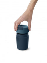 Joseph Joseph Sipp Travel Mug in blue, 340 ml, features a flip-top cap for hygiene, leakproof lid, and soft-touch grip.