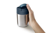 Sleek anthracite travel mug with double-wall insulation, leakproof lid, and hygienic flip-top for beverages on the go.