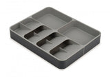 DrawerStore organizer with expandable sides, five stacked compartments for cutlery, and two deep sides for gadgets.