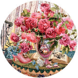 Circular 500-piece puzzle featuring vibrant watercolor flowers by Adelene Fletcher, ideal for puzzlers aged 8 and up.