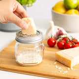 Kilner Fine Grater Storage Jar (250ml) featuring stainless steel grater, perfect for grating spices and storing fresh ingredients.