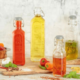 Kilner Clip Top Bottle 600ml with airtight seal, ideal for juices, oils, and sauces, featuring a stylish square design.