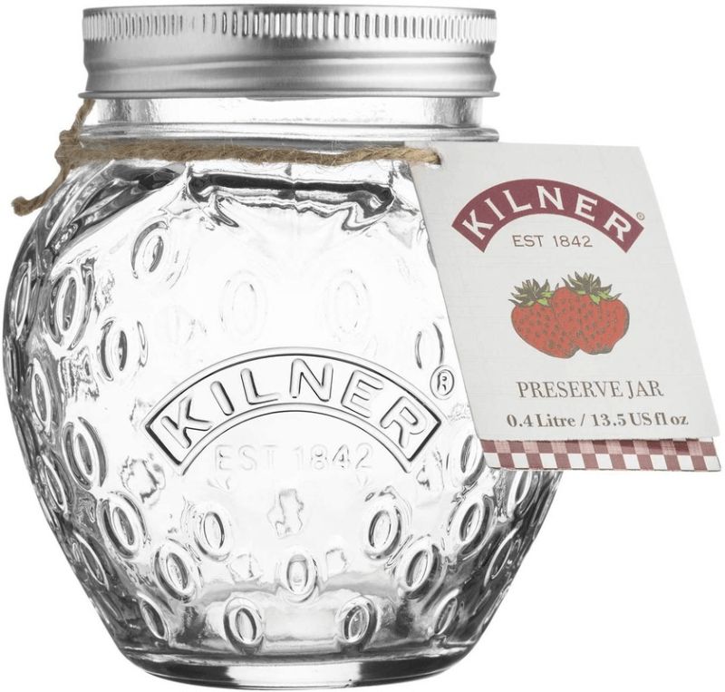 Clear glass Kilner strawberry fruit jar with vacuum seal lid, embossed design, ideal for preserving jams and chutneys.