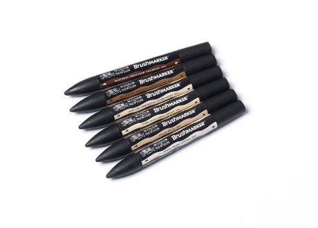 Set of 6 Winsor & Newton BrushMarkers in skin tones, featuring dual tips for detailed and broad coverage in vibrant colors.