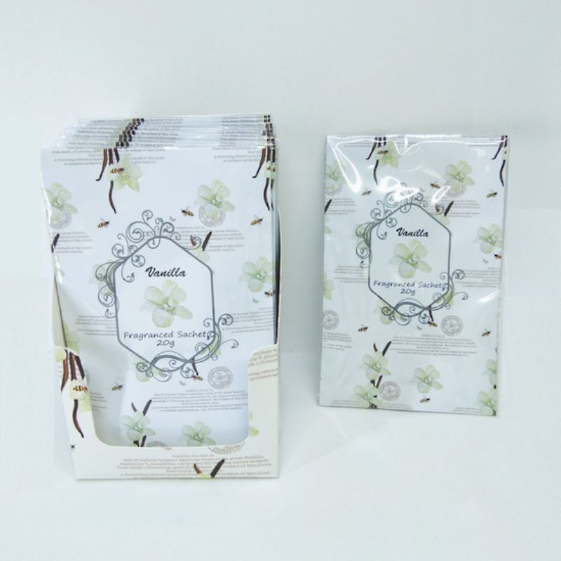 Vanilla-scented sachets in a 12-piece display, perfect for freshening spaces with warmth and elegance.