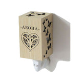 Aroha Wood Grain Plug In Night Light with soft ambient glow, perfect for kids' rooms and hallways, featuring elegant wood finish.