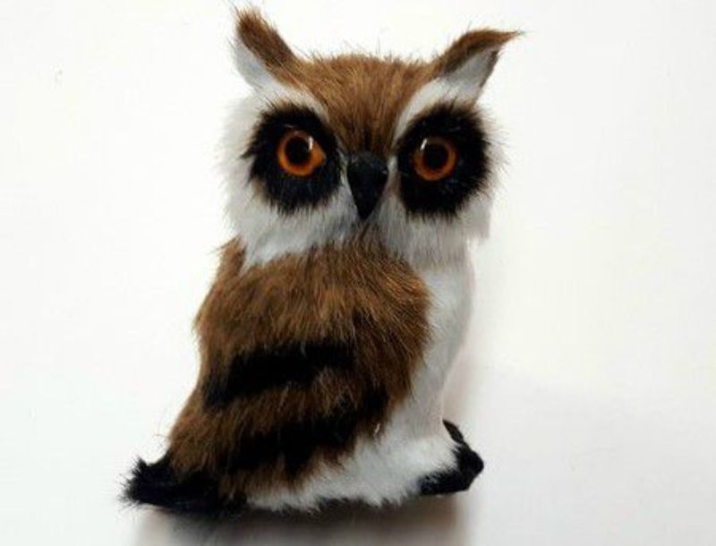 Ornamental brown owl figurine with bright eyes, featuring intricate feather details, perfect for home décor or as a unique gift.