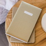 Stylish Boho Rattan photo album capable of holding 500 4x6 inch photos with acid-free pages and clear slip-in pockets.